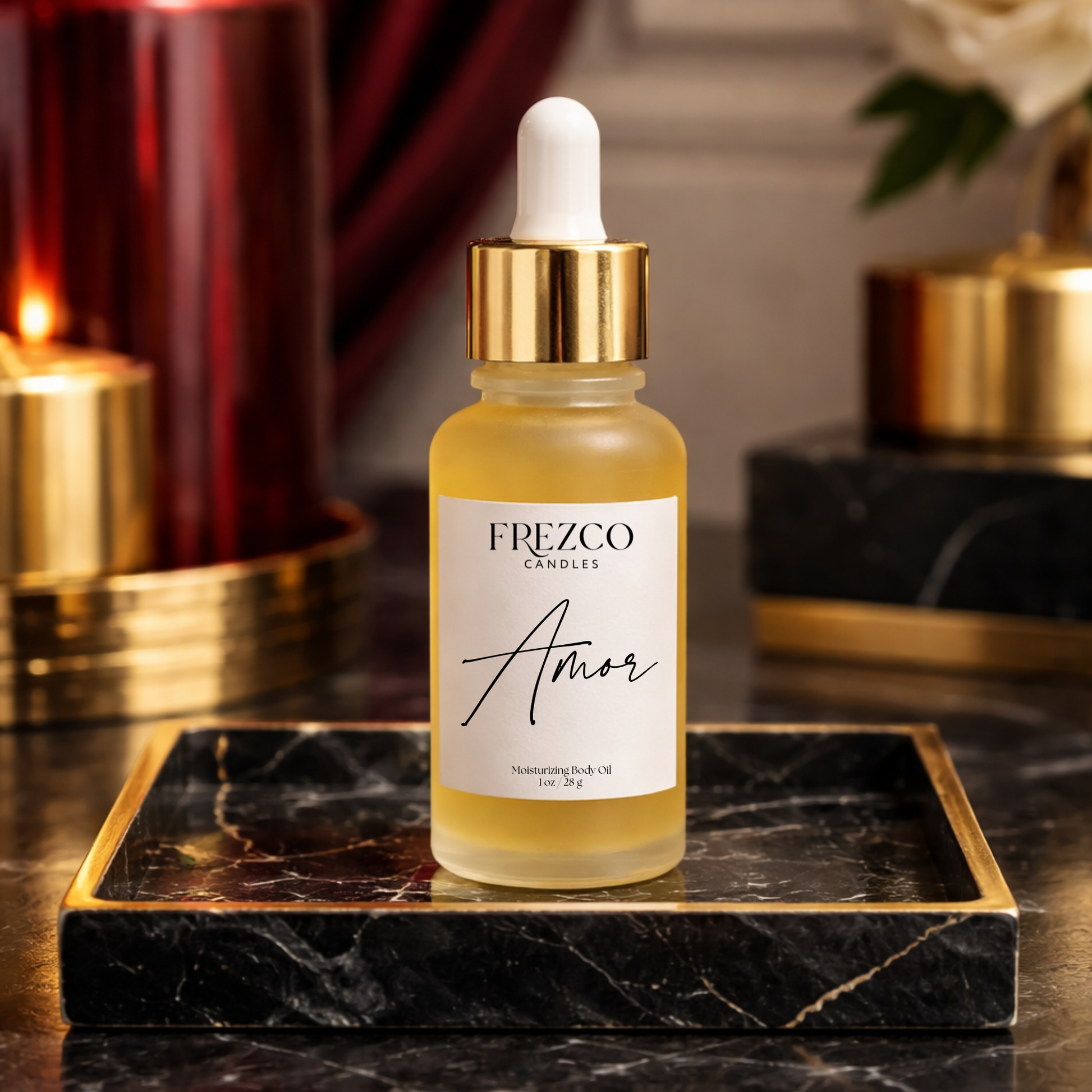 Frezco Candles Amor body oil bottle on a marble tray with candles in the background