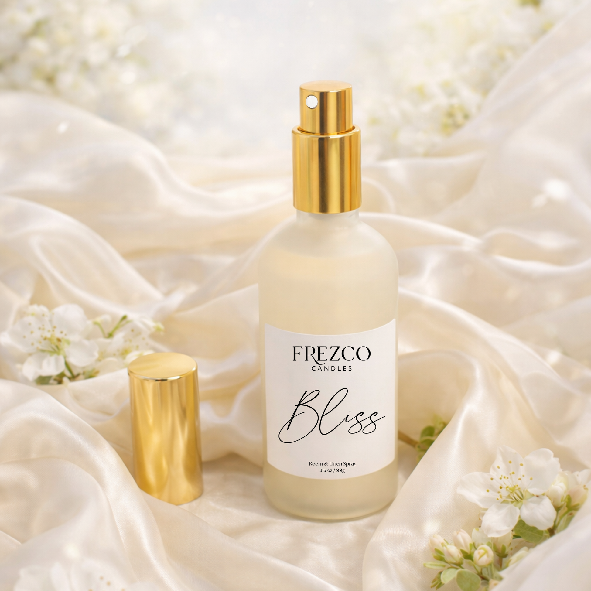 Frezco Candles Bliss perfume bottle on a soft fabric background with flowers.