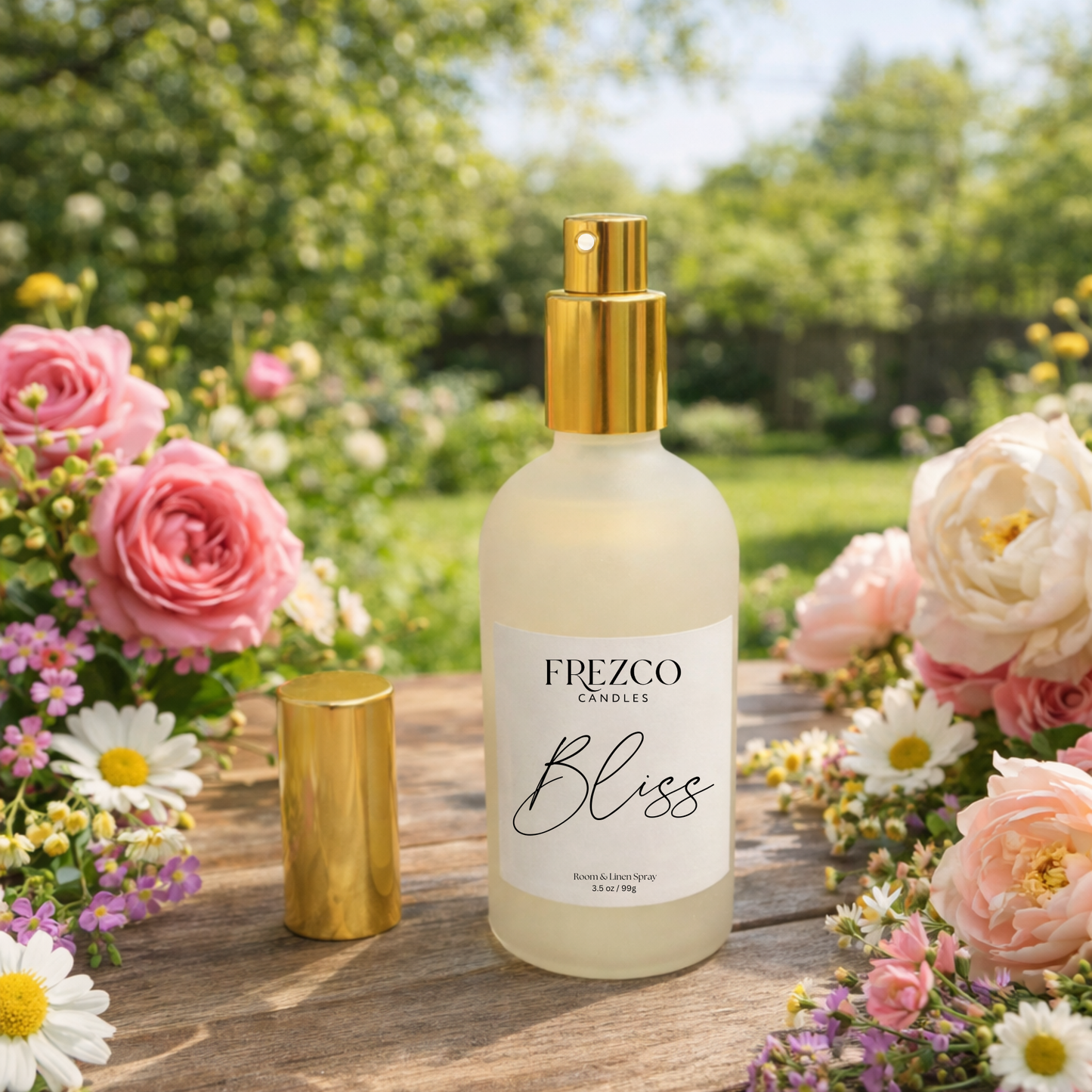 Frezco Bliss bottle with gold cap on a wooden surface surrounded by flowers