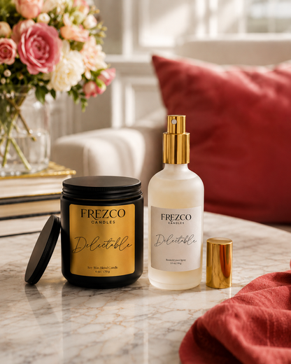 Frezco candles and spray on a marble surface with flowers and pillows in the background
