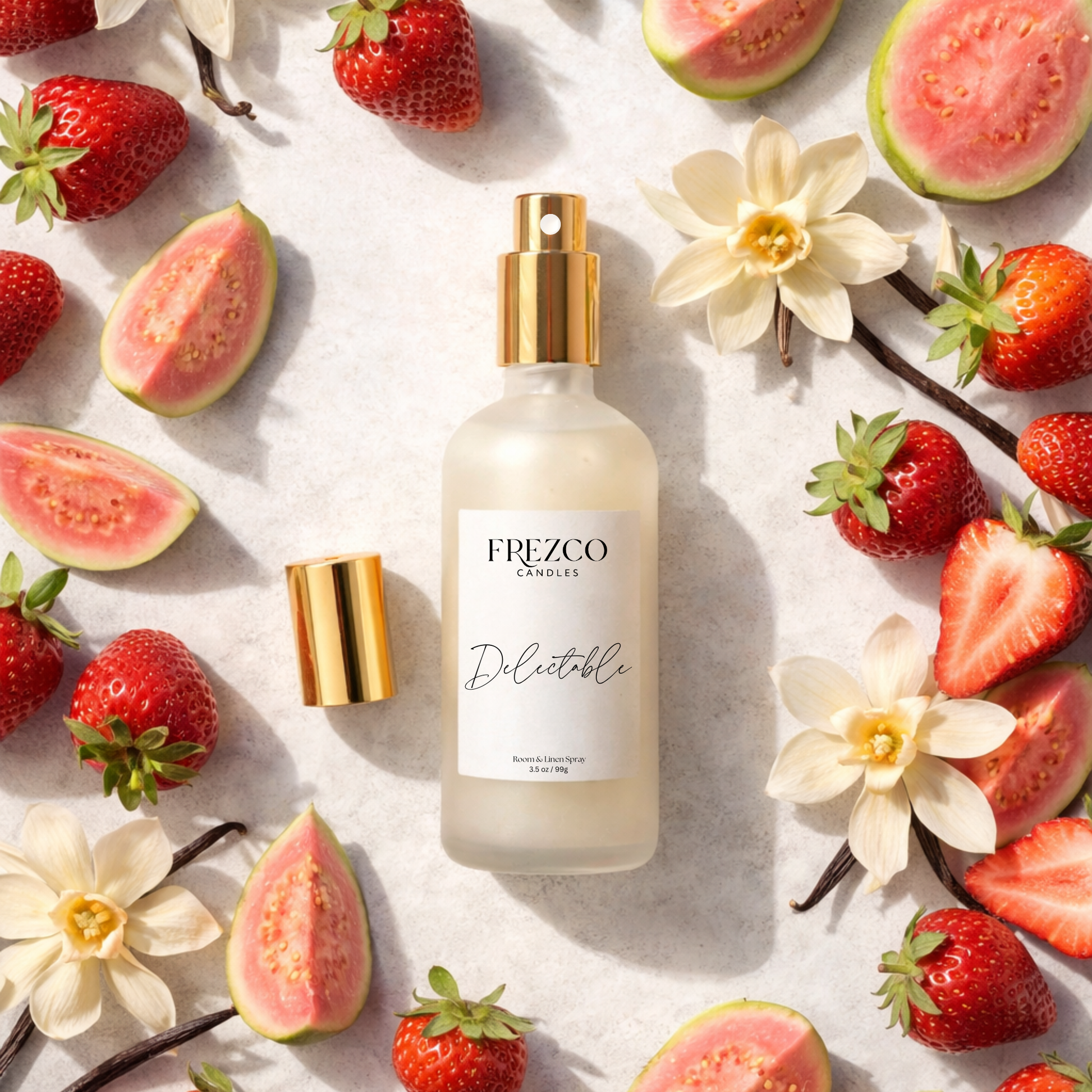 Frezco Candles Delectable Spray bottle surrounded by strawberries and guava on a light background